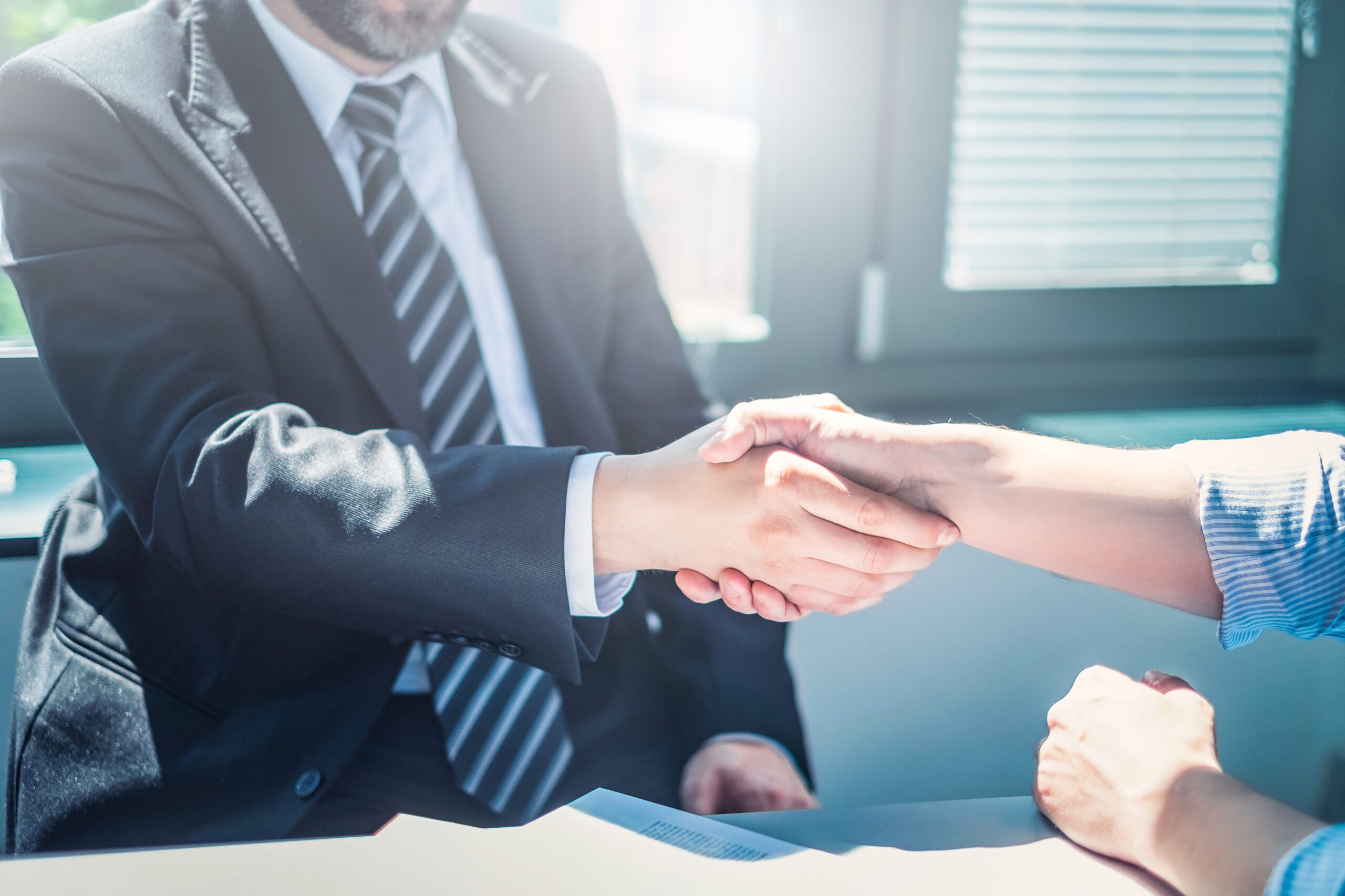 Business people shaking hands, finishing up meeting.
